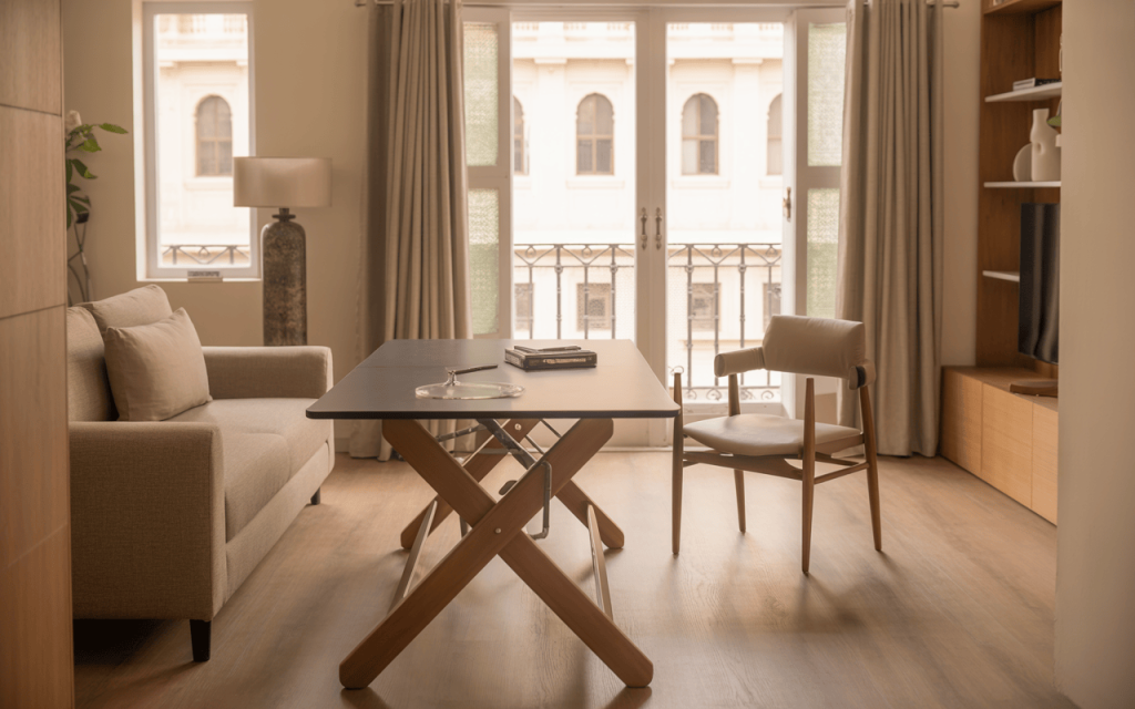 Cozy small folding dining table setup in a sunlit urban apartment corner