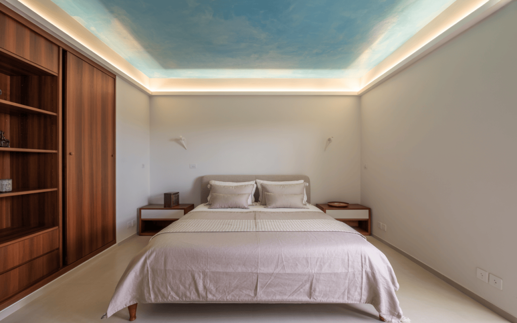 Elegant bedroom home colour design with sky-painted ceiling and warm wood tones
