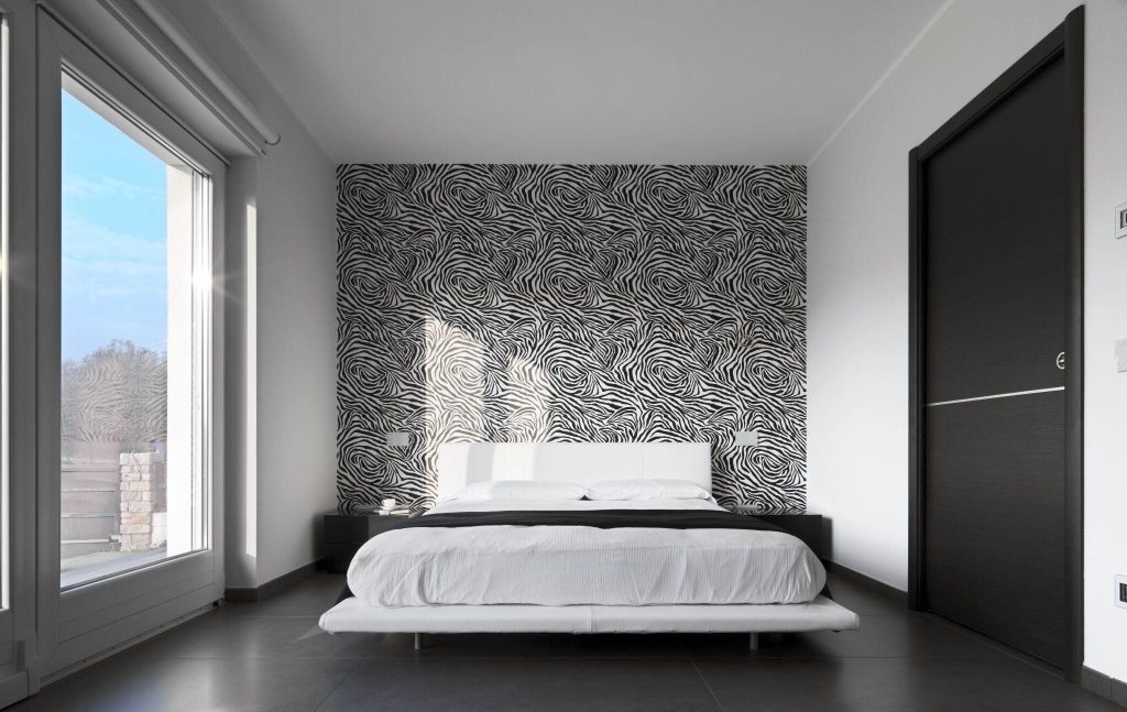 Stylish two-tone bedroom tile combinations with monochrome zebra wall design
