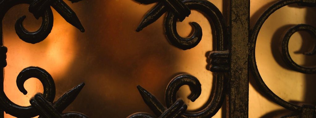 Artistic modern simple grill design with elegant scrollwork and warm lighting