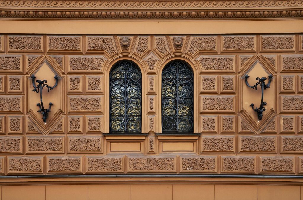 Elegant house modern window grill design highlighting ornate arches and luxury details