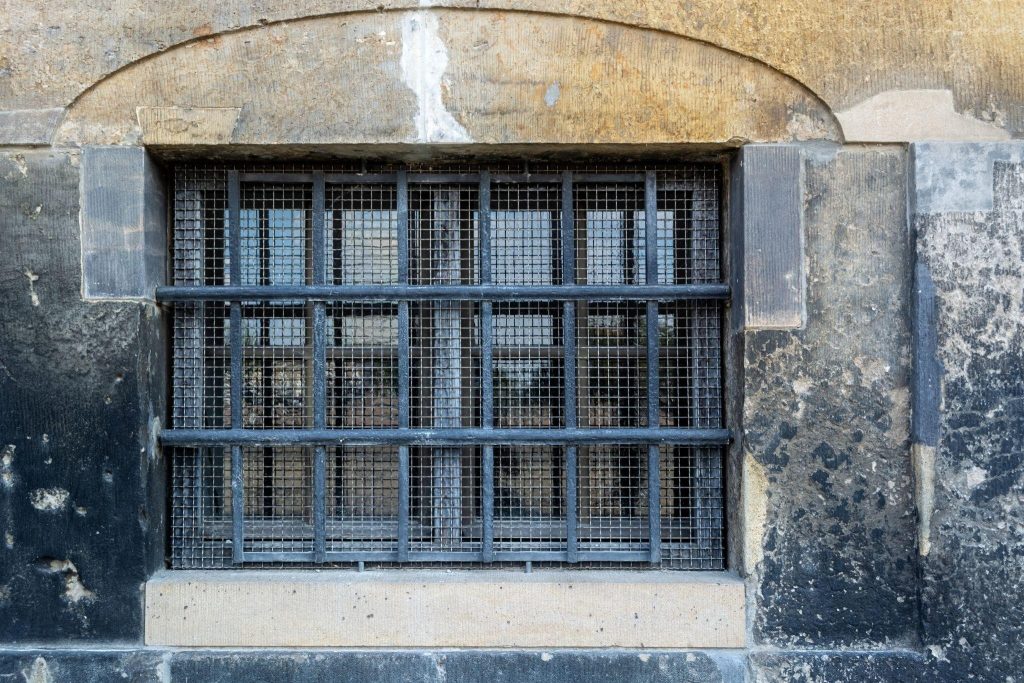 Strong iron modern window grill design adding protection and industrial charm to walls