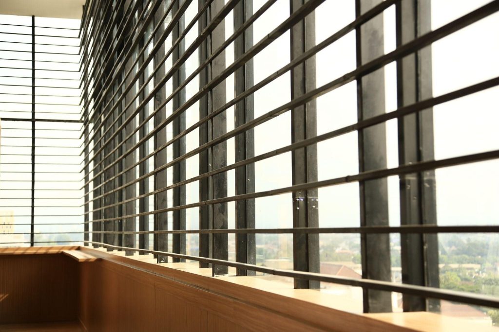 Sleek modern window grill design enhancing balcony safety with a stylish open layout