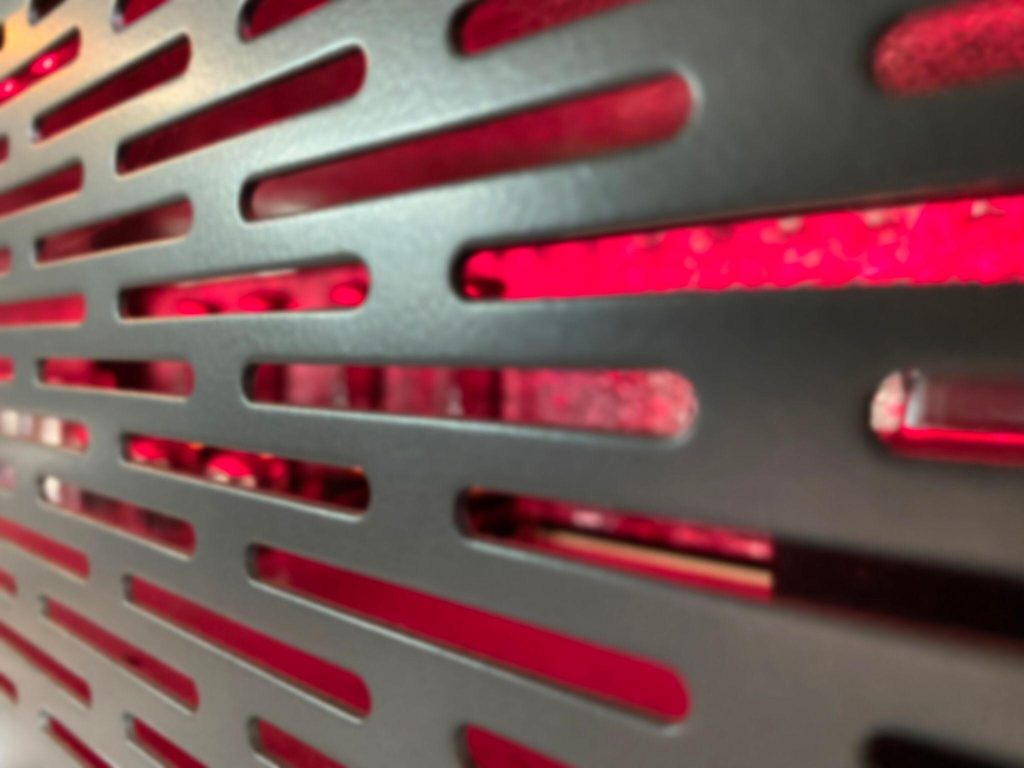 New modern window grill design featuring sleek metallic finish and red accent light