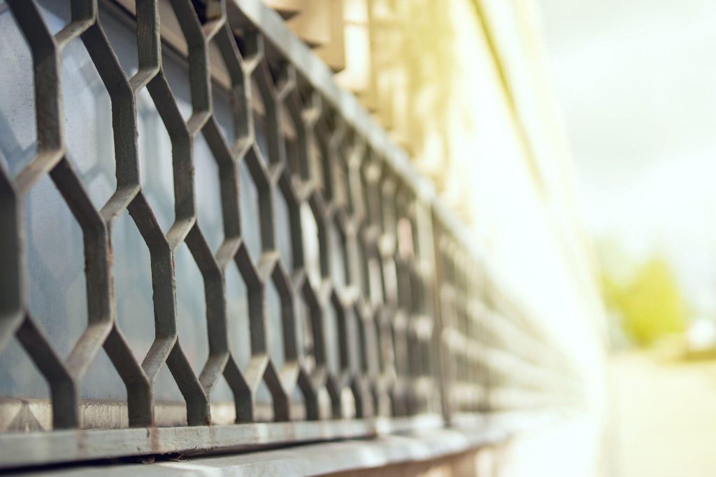 Sleek latest modern window grill design featuring geometric metal patterns for homes