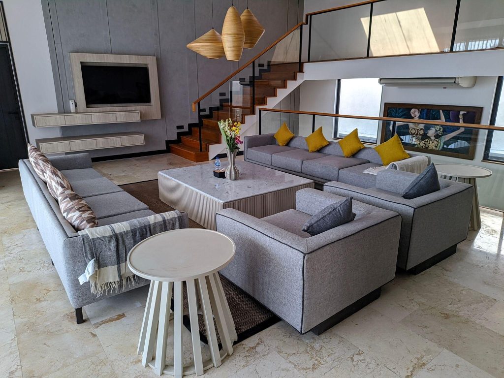 Luxury marble sofa table design centered in a modern living room with sectional seating