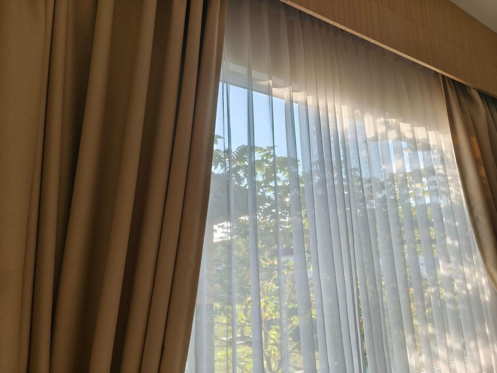 Bright best bedroom curtain ideas with beige drapes and sheer white panels for style