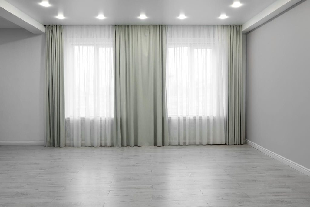 Minimalist master bedroom curtain ideas with soft gray drapes and modern lighting