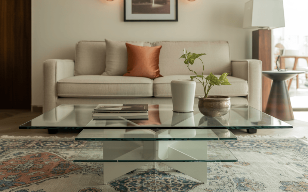 Stylish modern glass coffee table with layered design in a cozy living room