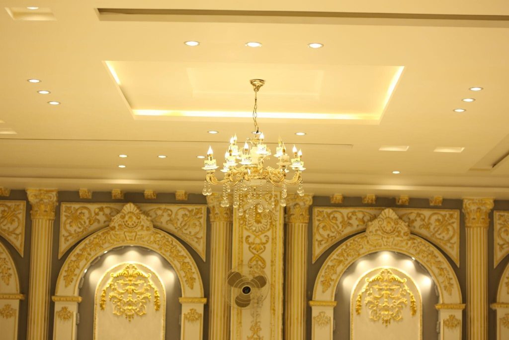 Elegant ceiling design trends with golden accents and luxurious chandelier lighting