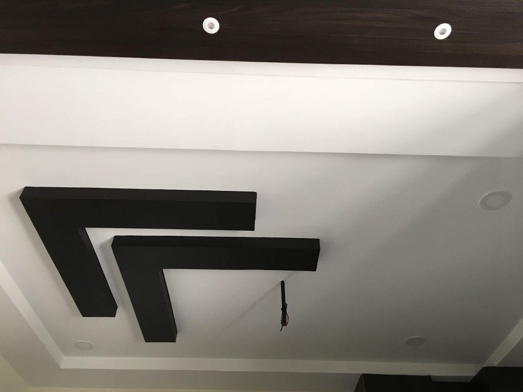 Stylish false ceiling design trends with bold geometric black panel accents