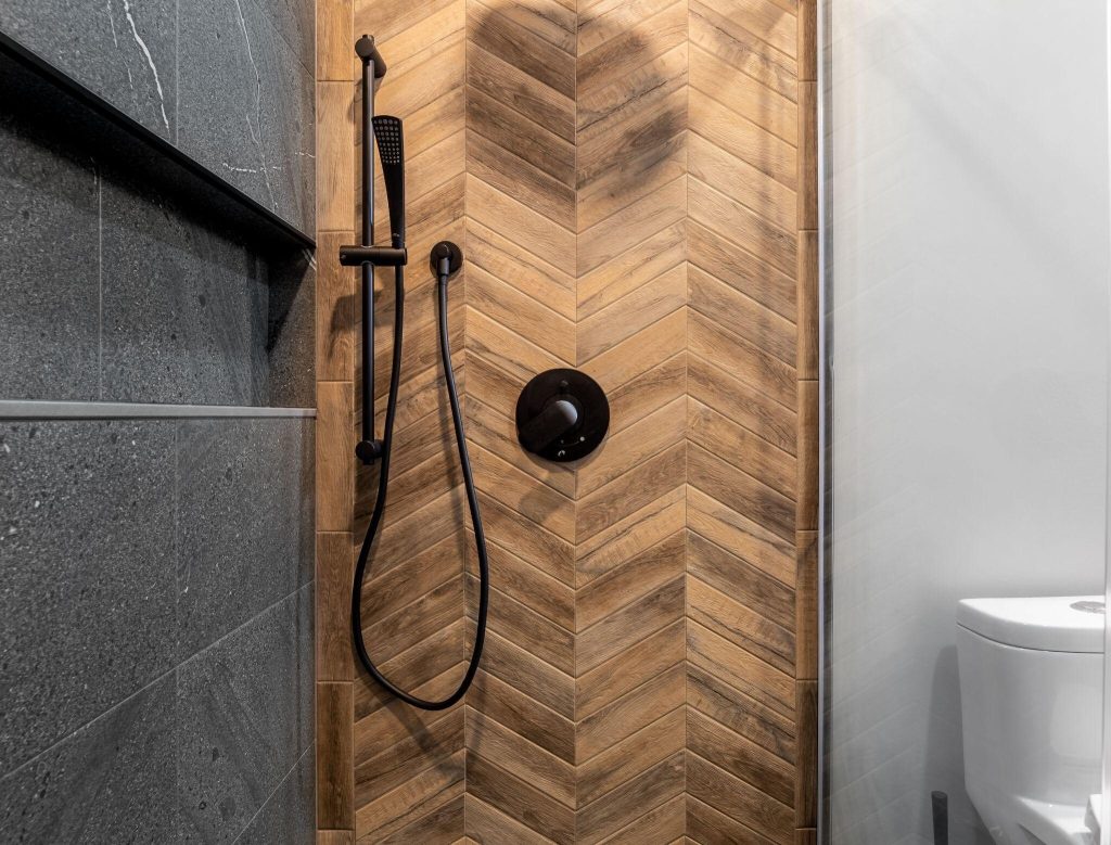 Contemporary master bathroom tile trends with wood texture shower wall and matte finish