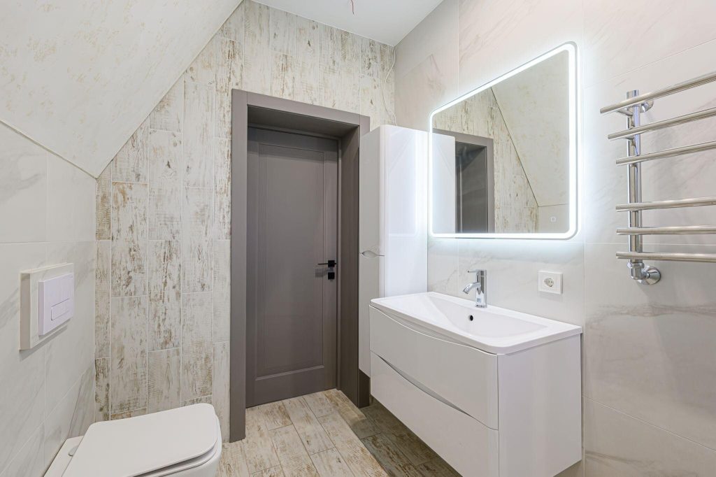 Modern bathroom mirror trends 2026 with LED square mirror and sleek vanity unit