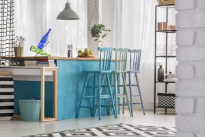 Modern cafe style kitchens with pastel blue island, colorful bar stools and open shelving design