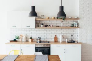 Minimal cafe style kitchens with white subway tiles, open shelves and wooden countertop design