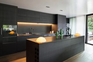 Luxury cafe style kitchens with dark cabinets, island counter and warm ambient lighting design