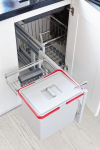 Kitchen corner units featuring pull-out waste bin system with smart storage and smooth sliding rails