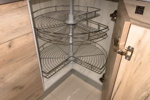 Modular kitchen corner units with rotating wire shelves offering easy access and efficient storage