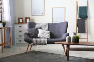 Stylish sofa designs modern living room with grey couch, cushions, and Scandinavian decor