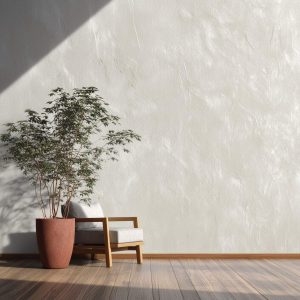 Minimalist textured wall designs with soft plaster finish, neutral tone wall and wooden chair with fabric cushion