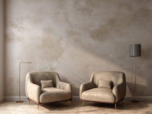 Elegant textured wall designs with warm beige finish, leather armchairs in soft neutral tones and modern lighting