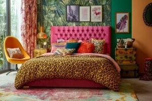 Modern maximalist interior design bedroom with bold colors, layered patterns and statement furniture