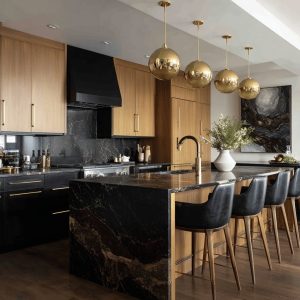 Stylish open kitchen designs with black marble island, wood cabinetry, gold lighting, and modern luxury appeal