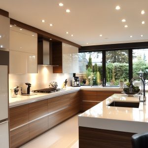 Modern Indian kitchen design with open layout cabinets and platform sink setup 
