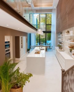 Luxury Indian kitchen design with island counter and tall glass windows 