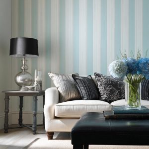 Modern white sofa set against simple wall designs with tape featuring soft blue stripes