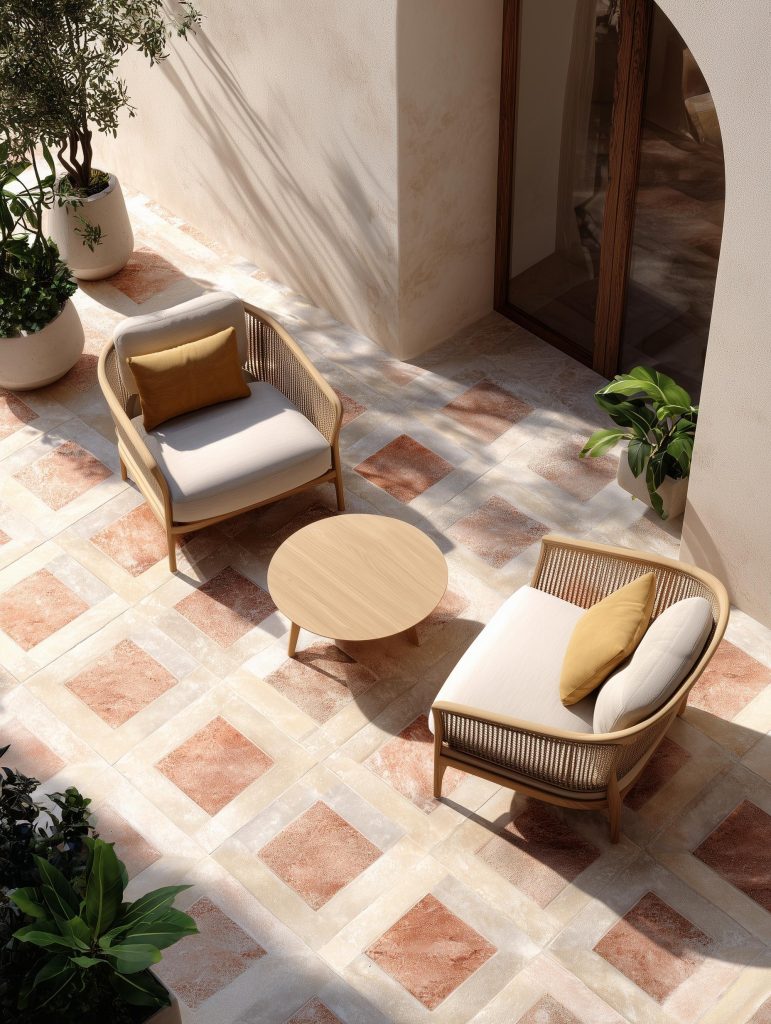 Mediterranean style balcony tiles design with diamond patterns and woven outdoor furniture