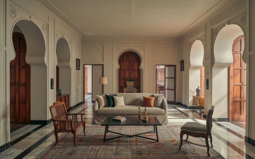 Classic heritage house interior design with grand arches marble flooring and carved wooden doors