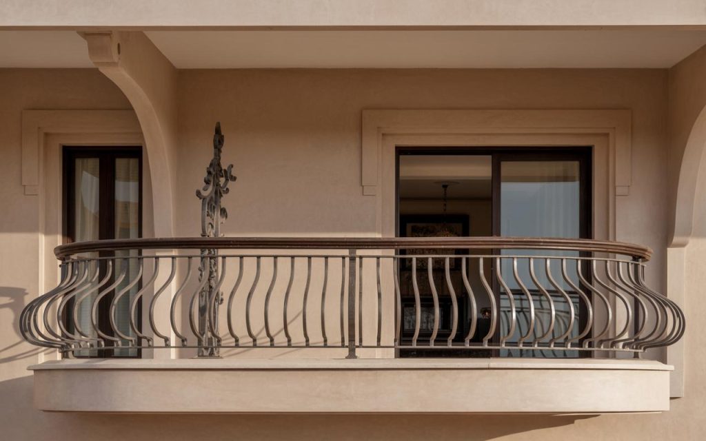 Latest iron railing design for balcony featuring curved metal bars with classic exterior appeal