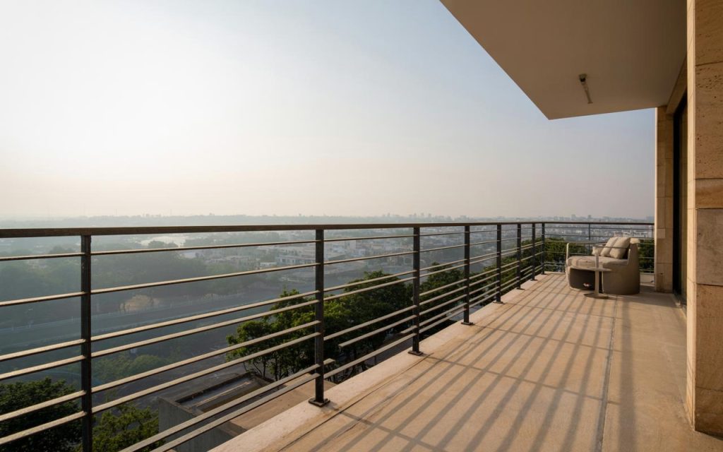 Stylish iron pipe railing design for balcony featuring horizontal bars and spacious modern outdoor view