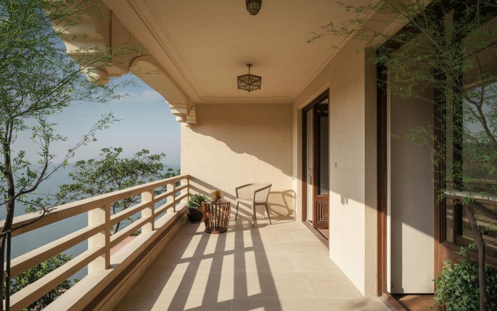 Bright Home vastu balcony with open layout, sunlight, and minimal seating for balanced energy flow