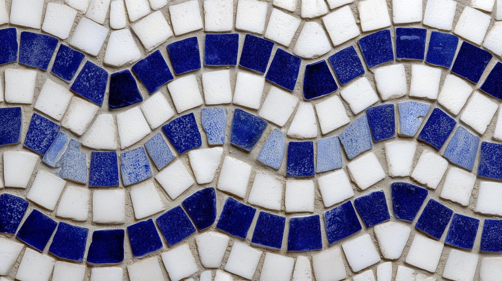 Detail of vibrant blue and white wavy patterns in mosaic and terrazzo flooring for modern homes.