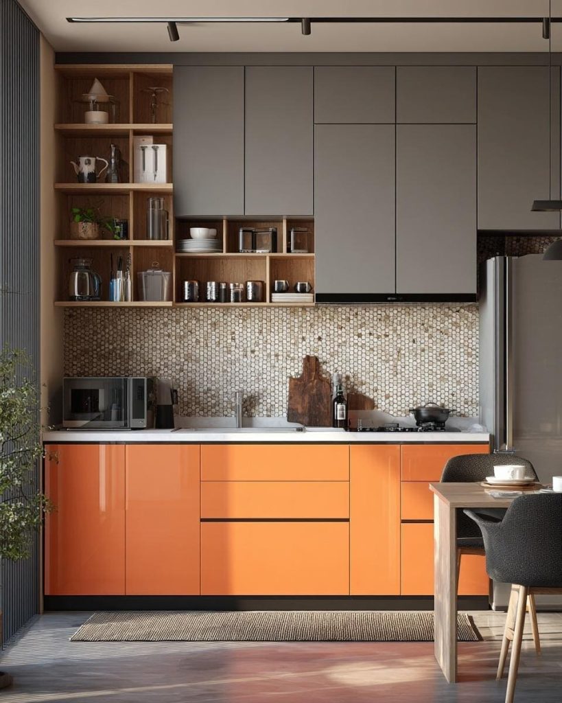 Vibrant orange base cabinets paired with sleek grey modular kitchen plywood designs.