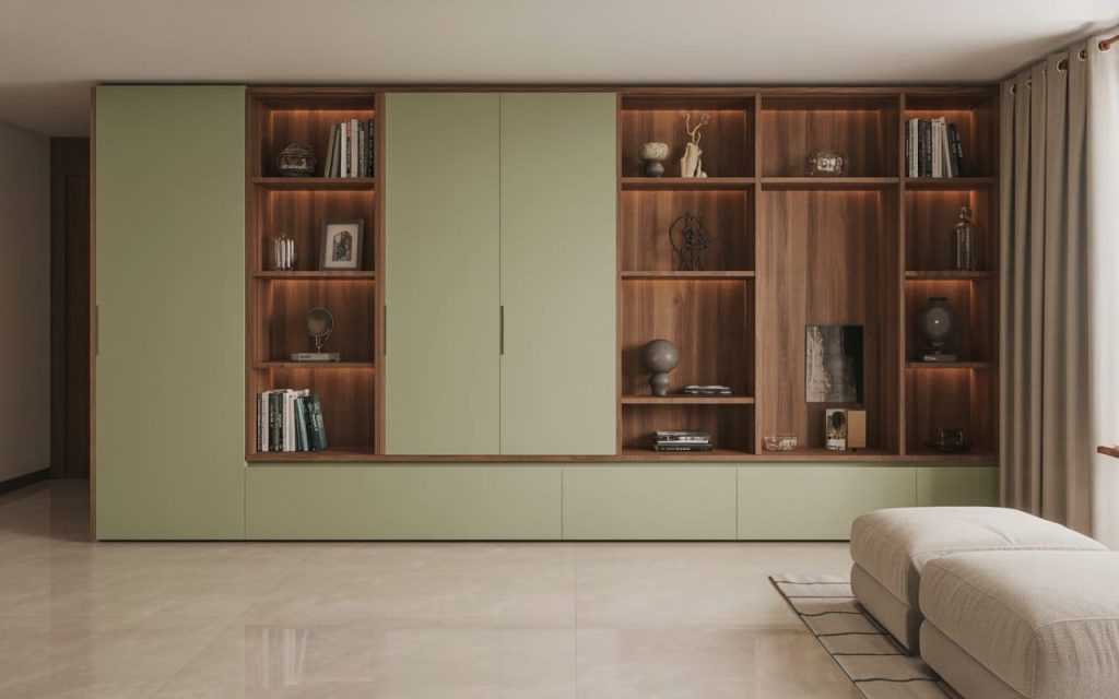 A sage green living room interior design with a large modular shelving and storage unit.