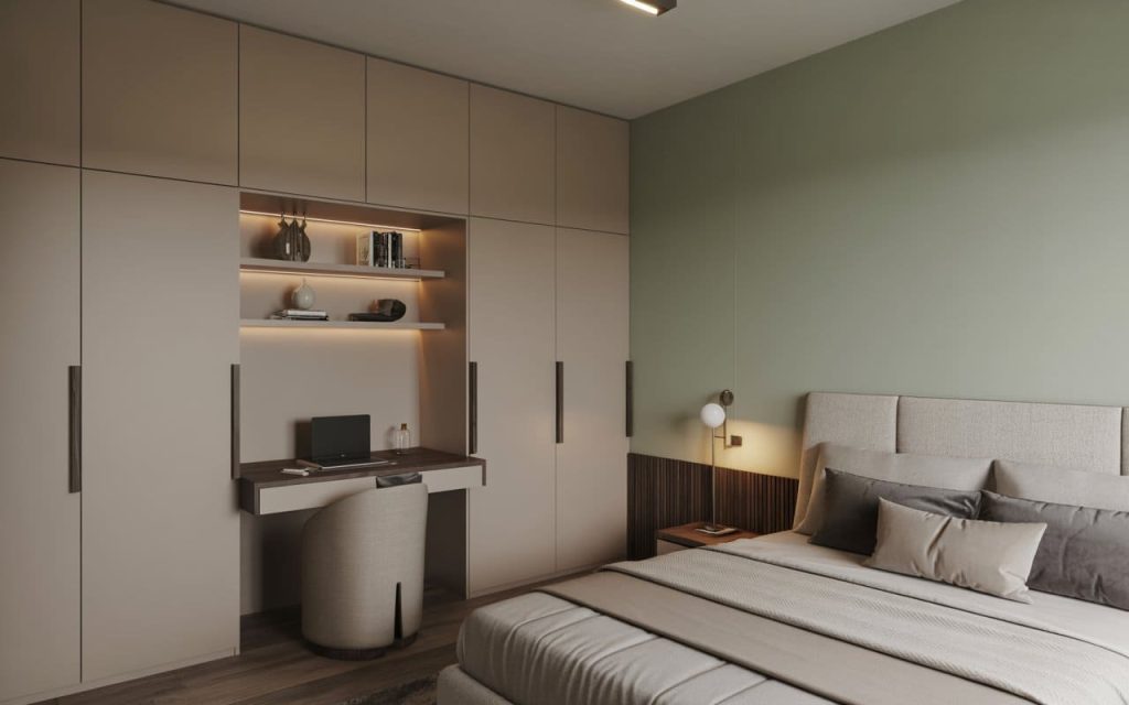 A simple bedroom interior design featuring a built-in desk within a modular wardrobe unit.