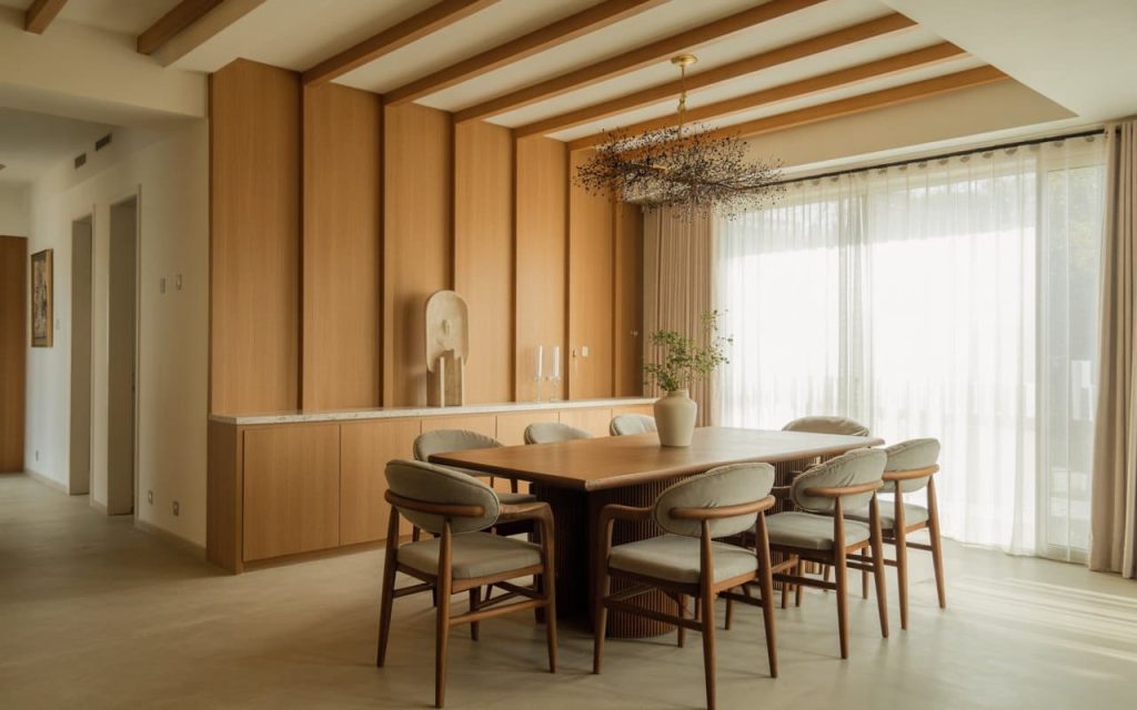 Vertical light oak wpc 3d wall panel flowing from the wall to create a ceiling rafter effect.