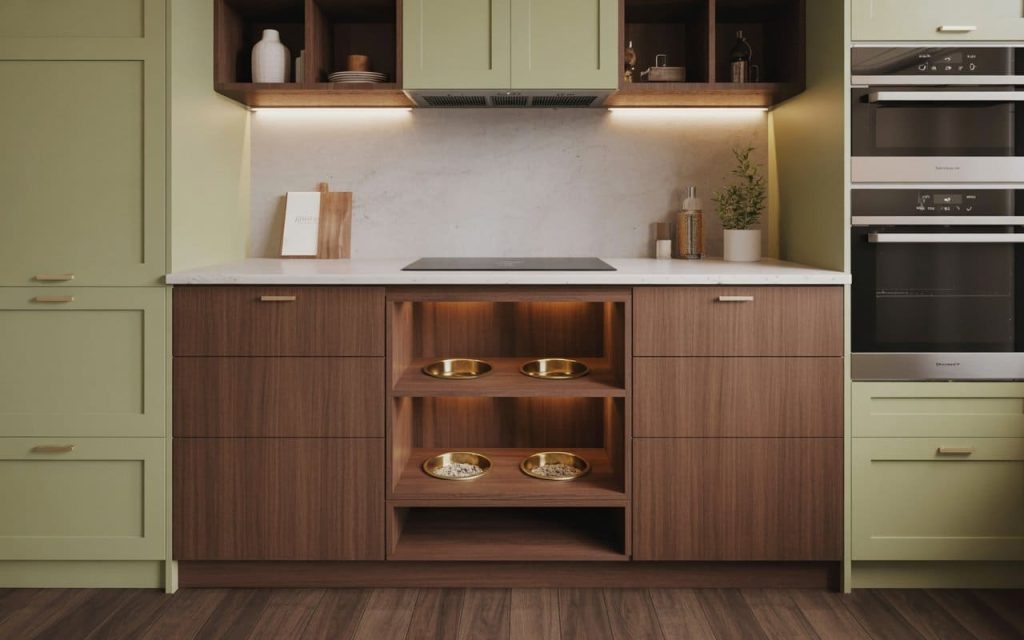 A clever space saving interior design featuring integrated pet feeding bowls in cabinetry.