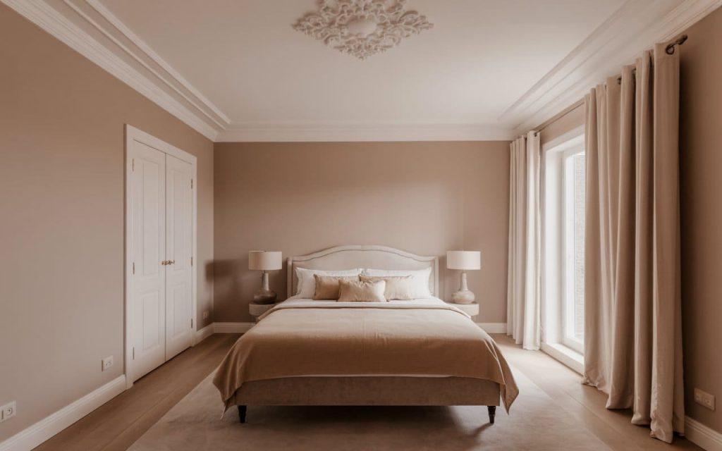 Soft beige and cream master bedroom two colour combination for bedroom walls with moulding.