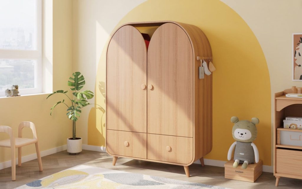 A curved kids wooden wardrobe in a bright room with yellow accents and a play chair.