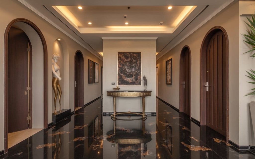Luxury black colour granite flooring with glossy finish in a grand hallway interior design