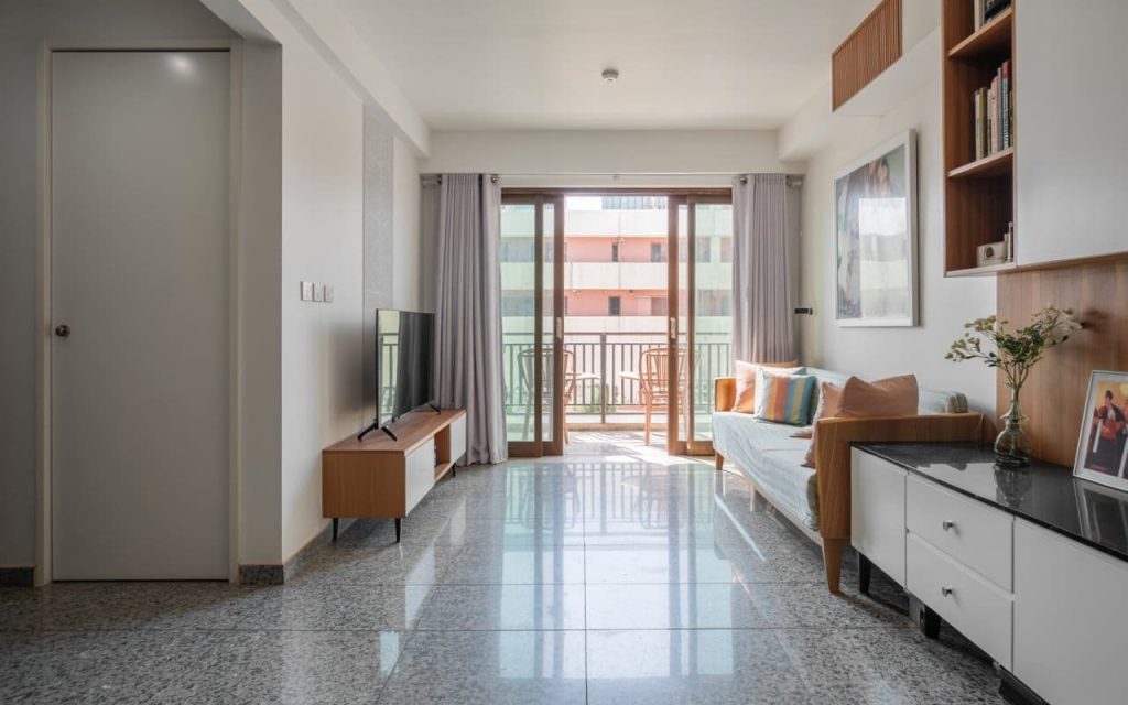 Modern grey colour granite flooring with glossy finish in a bright minimalist living room