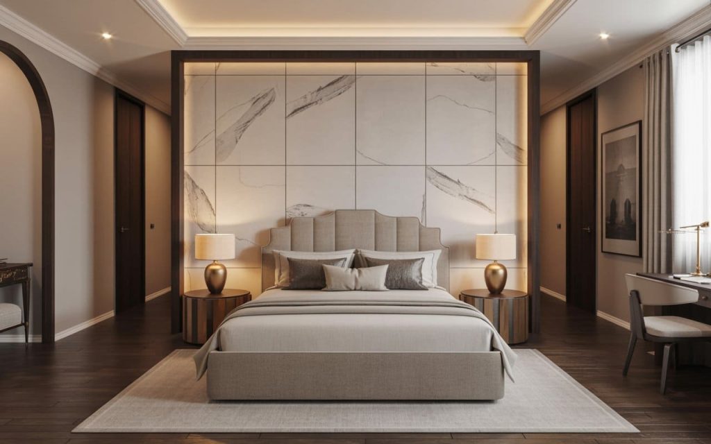 Bedroom wall tiles design with white marble-patterned panels, framed headboard, lamps, desk.