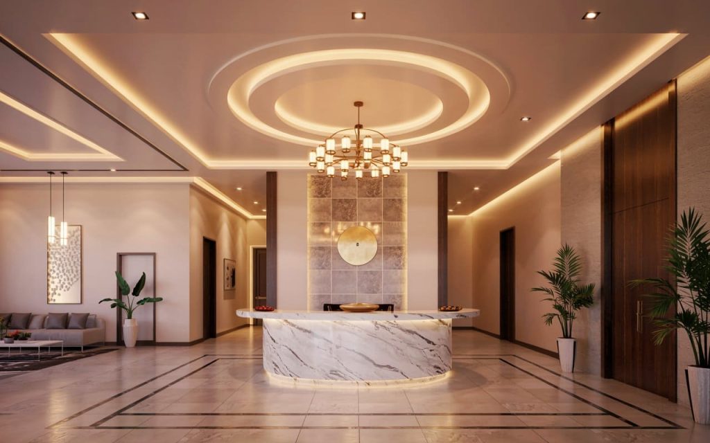 Circular multi-layered pop design for hall featuring a gold chandelier and warm lighting.