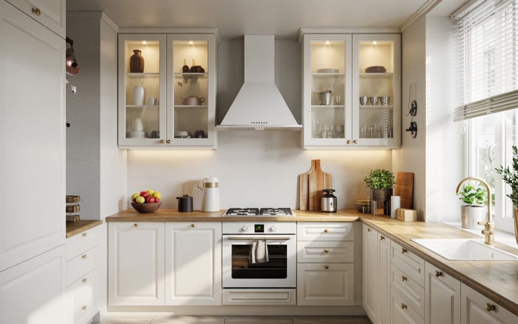 Kitchen furniture design in small space using white shaker cabinets and a wooden countertop.