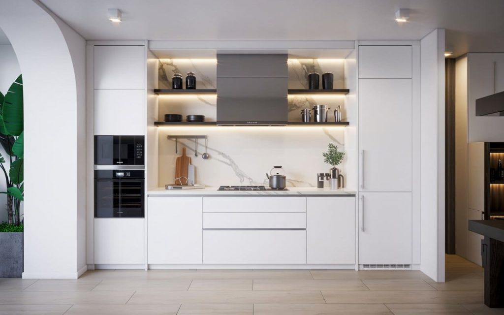 A modern small kitchen furniture design for Indian homes with minimalist cabinetry and integrated appliances.