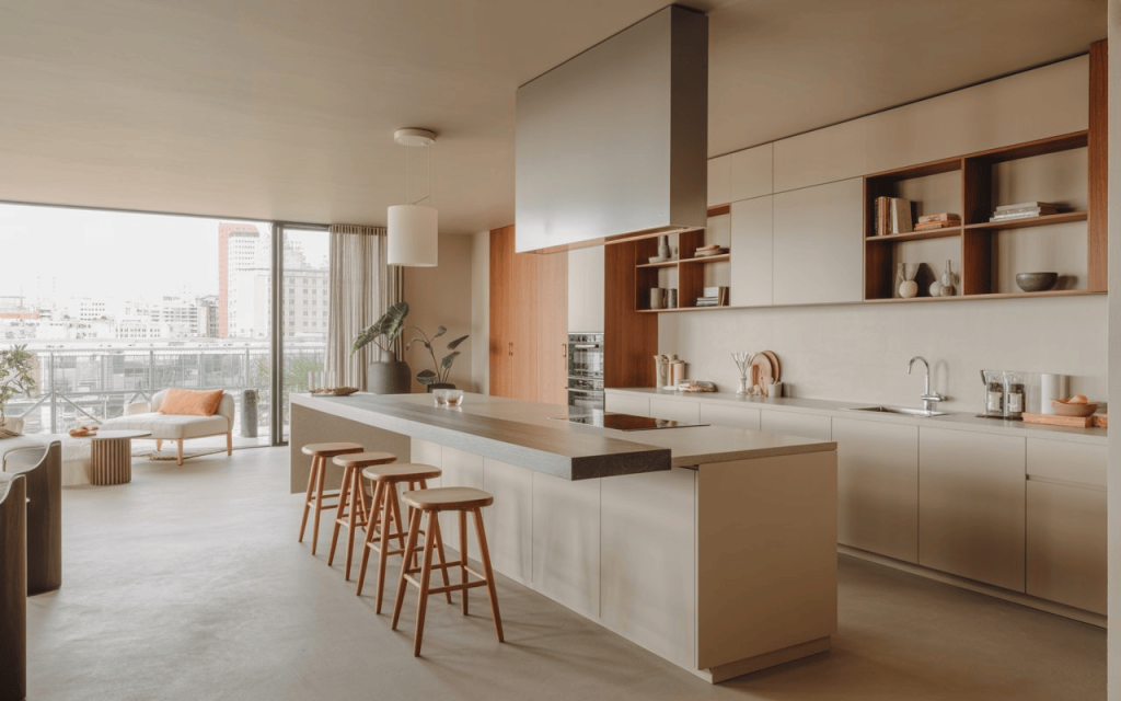 Stylish open kitchen slab design with large island and modern cabinetry in bright spacious home